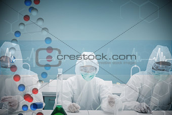 Composite image of chemists working in protective suits