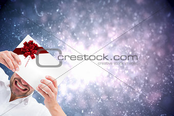 Festive man holding a christmas gift