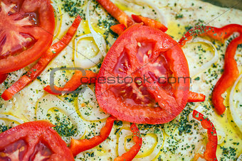 Tomato slice detail of traditional Italian focaccia bread