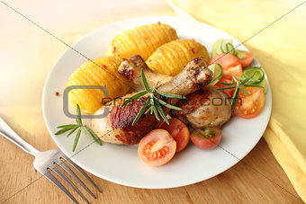 roasted chicken leg with fried potato