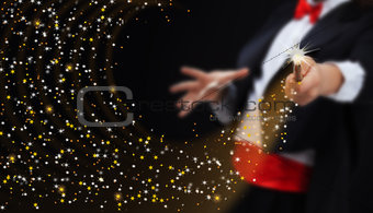 Magician hands with sparkling stars