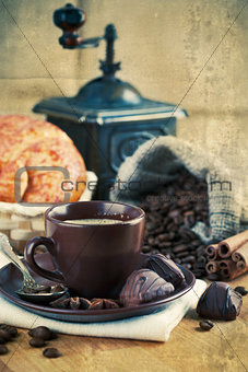 Cup coffee with grain and croissants