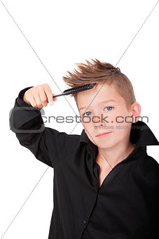 Boy brushing hair.