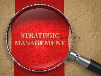 Strategic Management - Magnifying Glass on Old Paper.