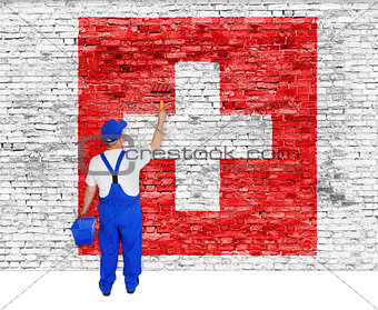 House painter covers wall with flag of Switzerland