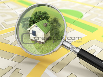 City building in tne magnifier. House search concept.