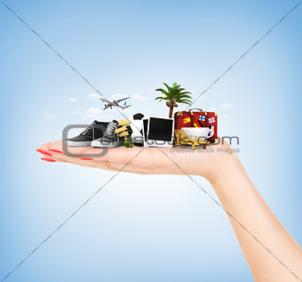 Travel concept. Hand holding atribute of travel and holiday.