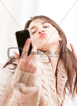 young woman making herself a selfie