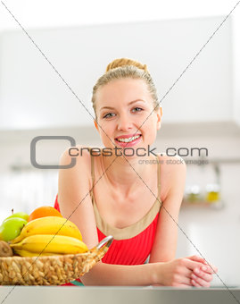 Portrait of young woman with fruits