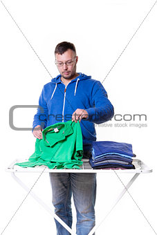 man putting laundry