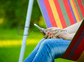 Young Woman Using Mobile Smart Phone Outdoors