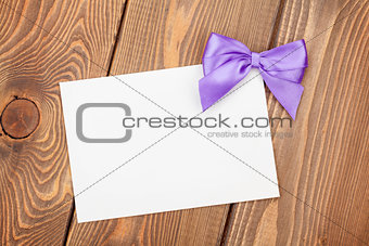 Greeting card with purple bow