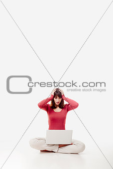 Stressed woman with a laptop