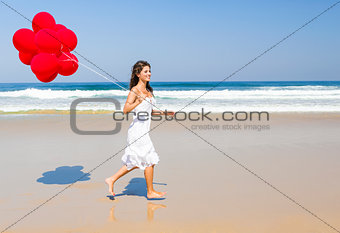 Girl with red balloons