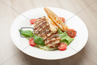Gourmet caesar salad with grilled meat fillet, cherry tomatoes, 
