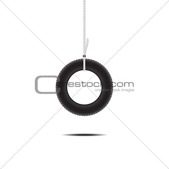 Car tire hanging on rope