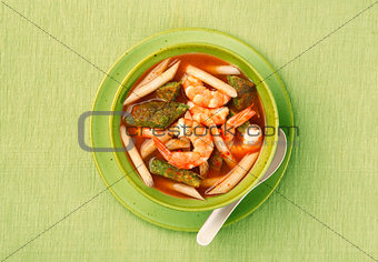 Sour soup made of tamarind paste with shrimp and several kinds of vegetables.