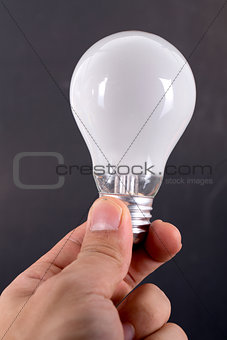Holding white bulb 