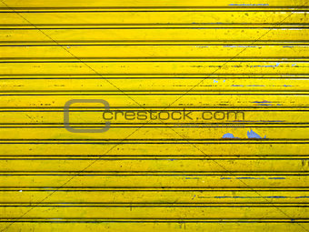 grunge bright yellow roller shutter door texture background