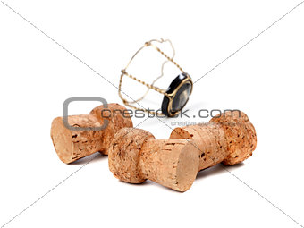 Three corks from champagne wine and muselet isolated on white ba