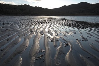 Sand Ripples, Sun and Mountains