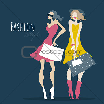 Fashion girls. Women with shopping bags.