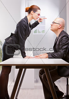 business woman violently facing a business man