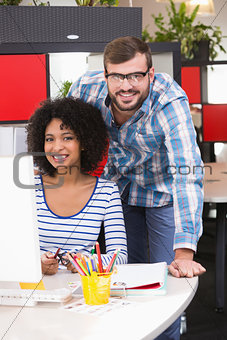 Photo editors using computer in office