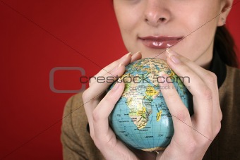 Globe in a girl's hands