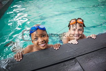 Little boys smiling in the pool