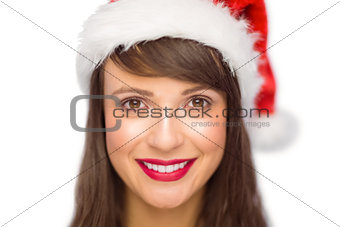 Close up portrait of pretty woman in santa hat smiling