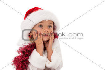 Cute little girl wearing santa hat and tinsel