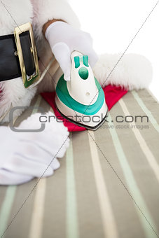 Santa claus ironing his hat