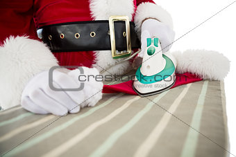 Father christmas ironing his hat