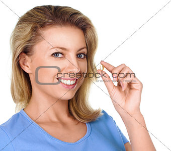 Portrait of woman with Omega 3 fish oil capsule