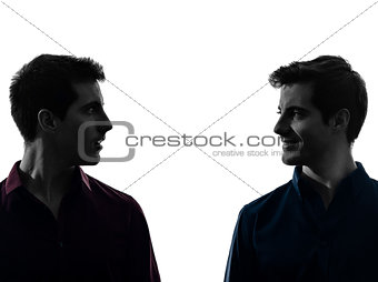 two  men twin brother friends looking at each others silhouette
