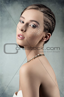 fashion lady with creative plait hairdo 