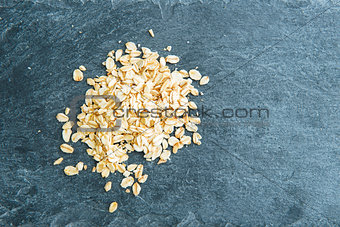 Closeup on oatmeal on stone substrate