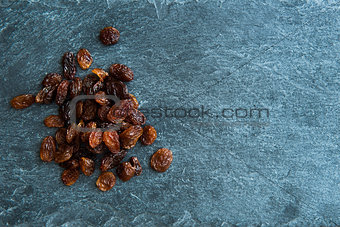 Closeup on raisins on stone substrate