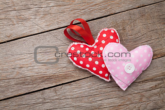 Valentines day toy hearts over wooden table background