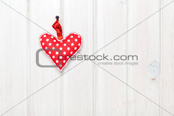 Valentines day toy heart over wooden table background