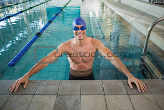 Fit swimmer in the pool at leisure center