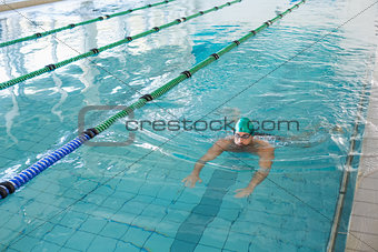 Man swimming in pool at leisure center