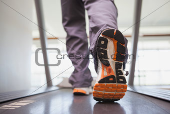 Fit man working out on treadmill