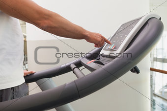 Fit man working out on treadmill
