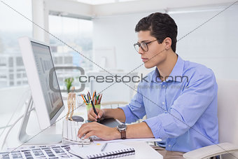 Photo editor working at his desk