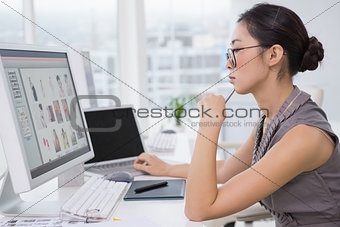 Photo editor working at her desk