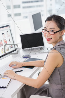 Photo editor working at her desk