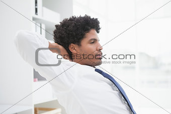Peaceful businessman relaxing at work