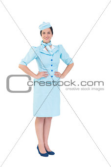 Pretty air hostess smiling at camera